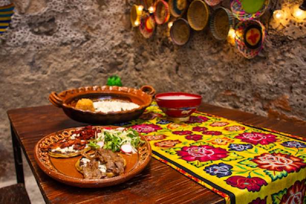 table nicely laid out with plates of mexican food