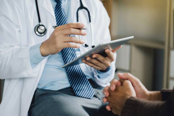 doctor talking to patient