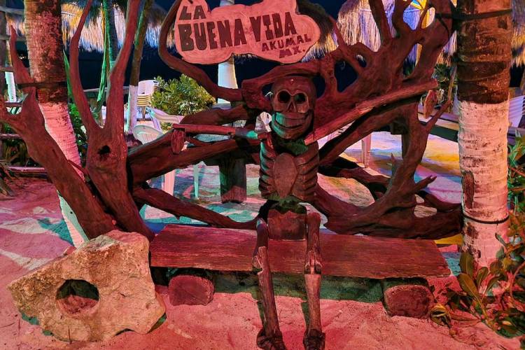 wooden skeleton decoration outside a bar in Mexico